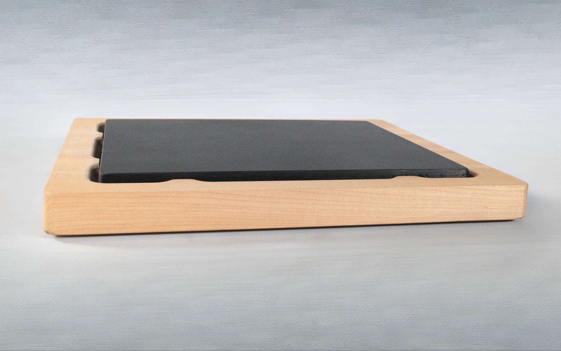 Wooden Cutting butcher block with a food grade plastic cutting board insert on a white background