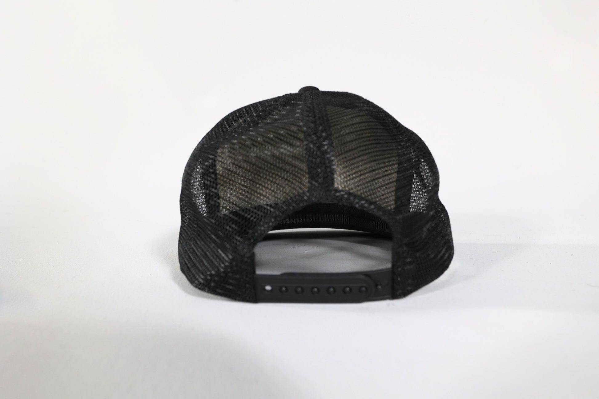 Black mesh baseball cap on a white background